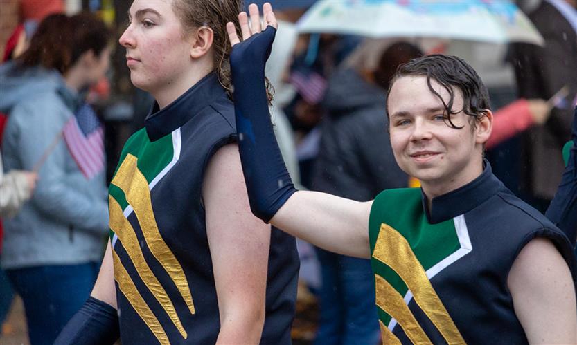Students march in a Veterans Day Parade